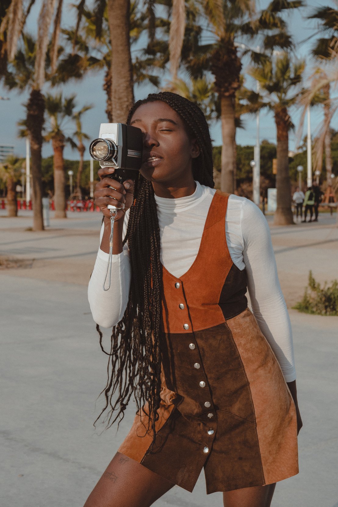 Teen Girl Using a Vintage Film Camera at the Park