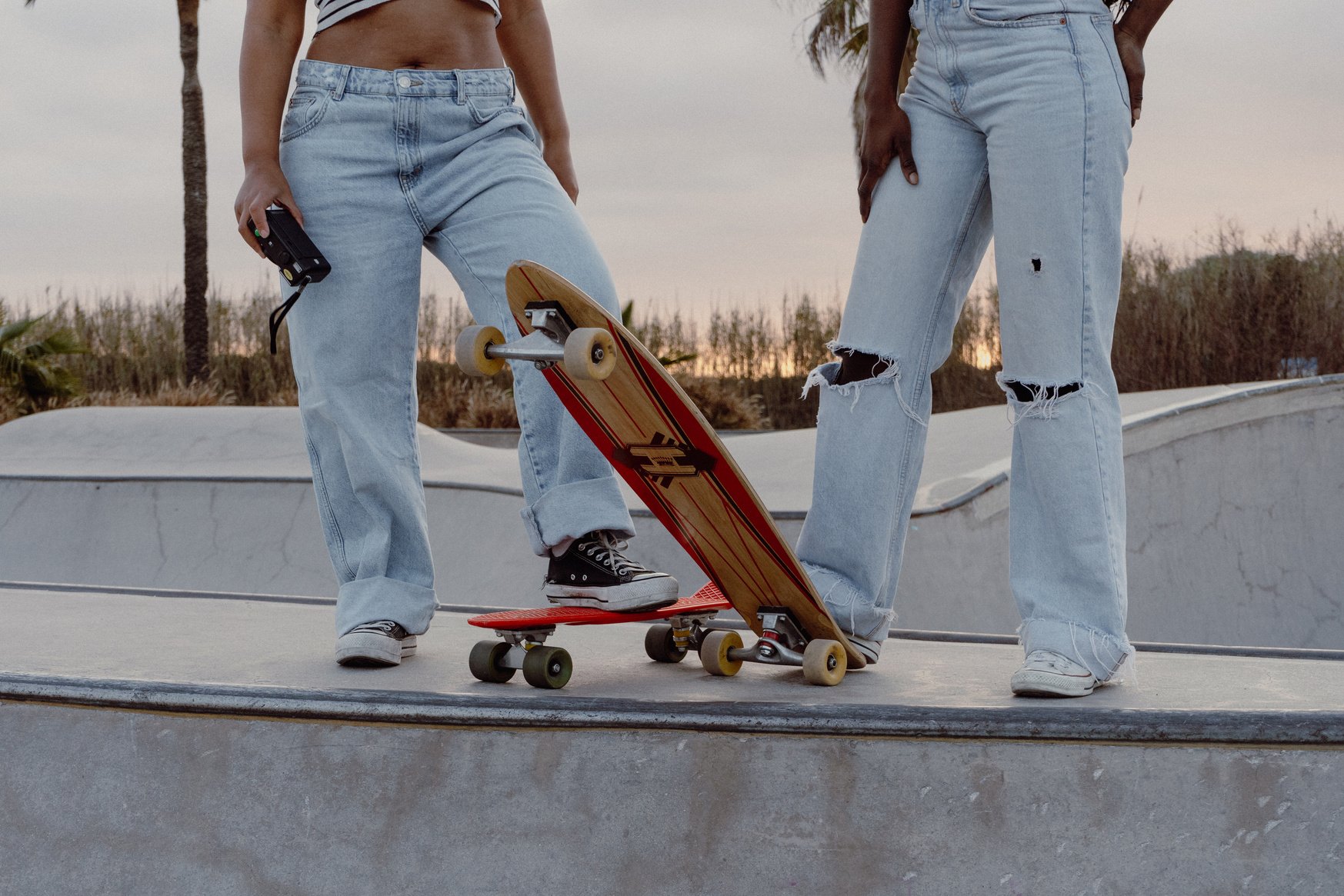 Two Female Skateboarders in a Skate Park